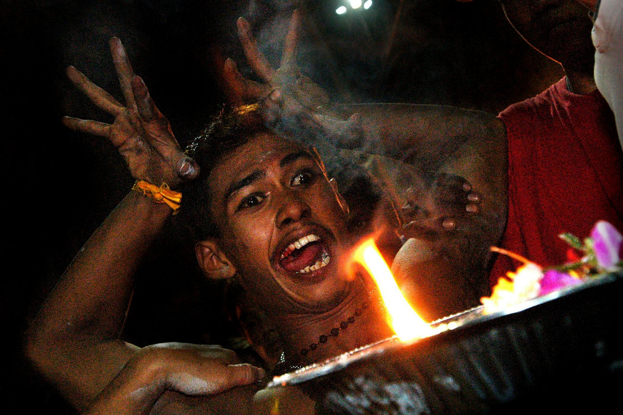 A devotee in trance before making the final journey to the temple in the Batu Caves on January 5, 2005. – AFP pic