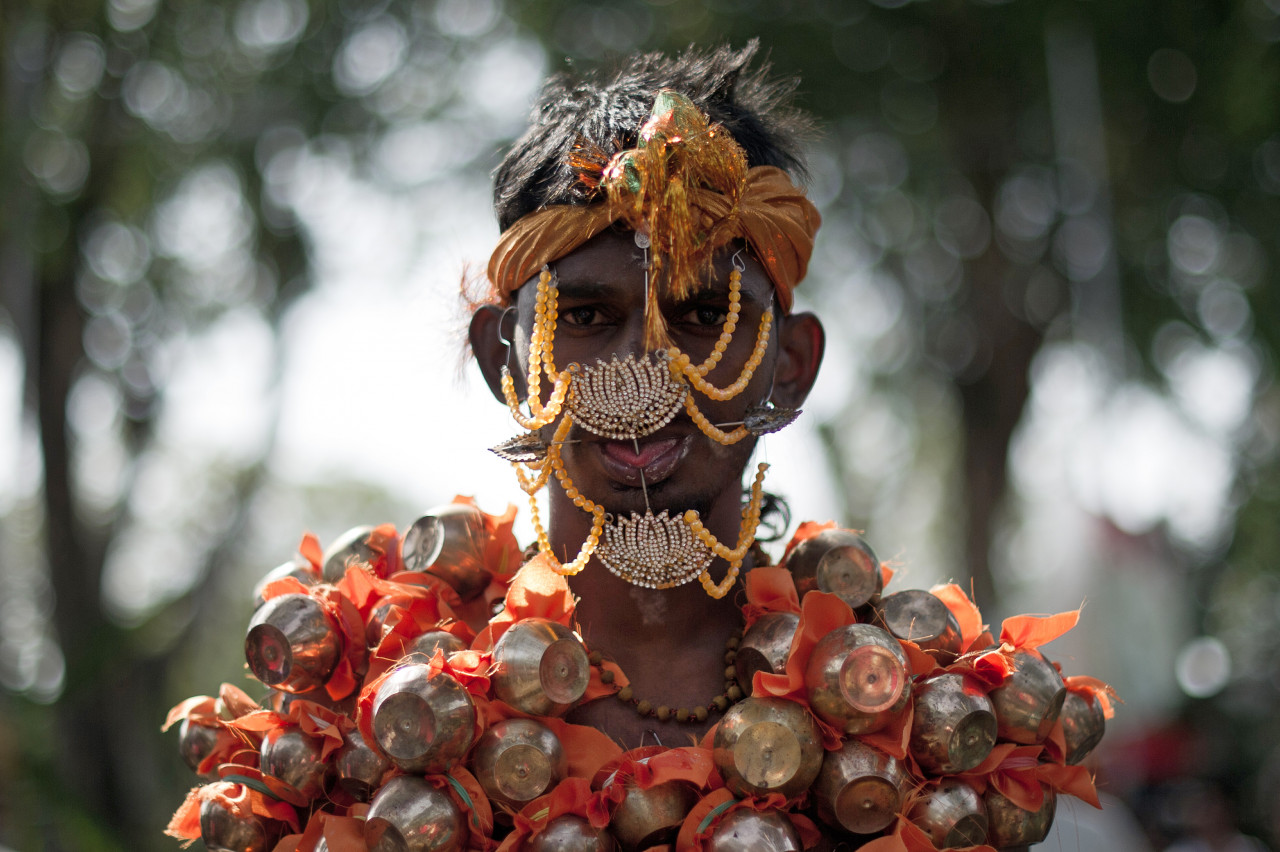A Hindu devotee with his tongue pierced and a jaw locked makes his way towards the Hill Top Murugan temple during Thaipusam in Georgetown, Penang on January 17, 2014. – AFP pic