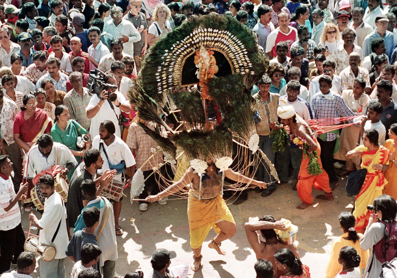 A Hindu devotee carries a ‘kavadi’ while dancing amongst the crowds at the Batu Caves Hindu temple on January 21, 2000. Before the pandemic, devotees would usually flock the temple. – AFP pic