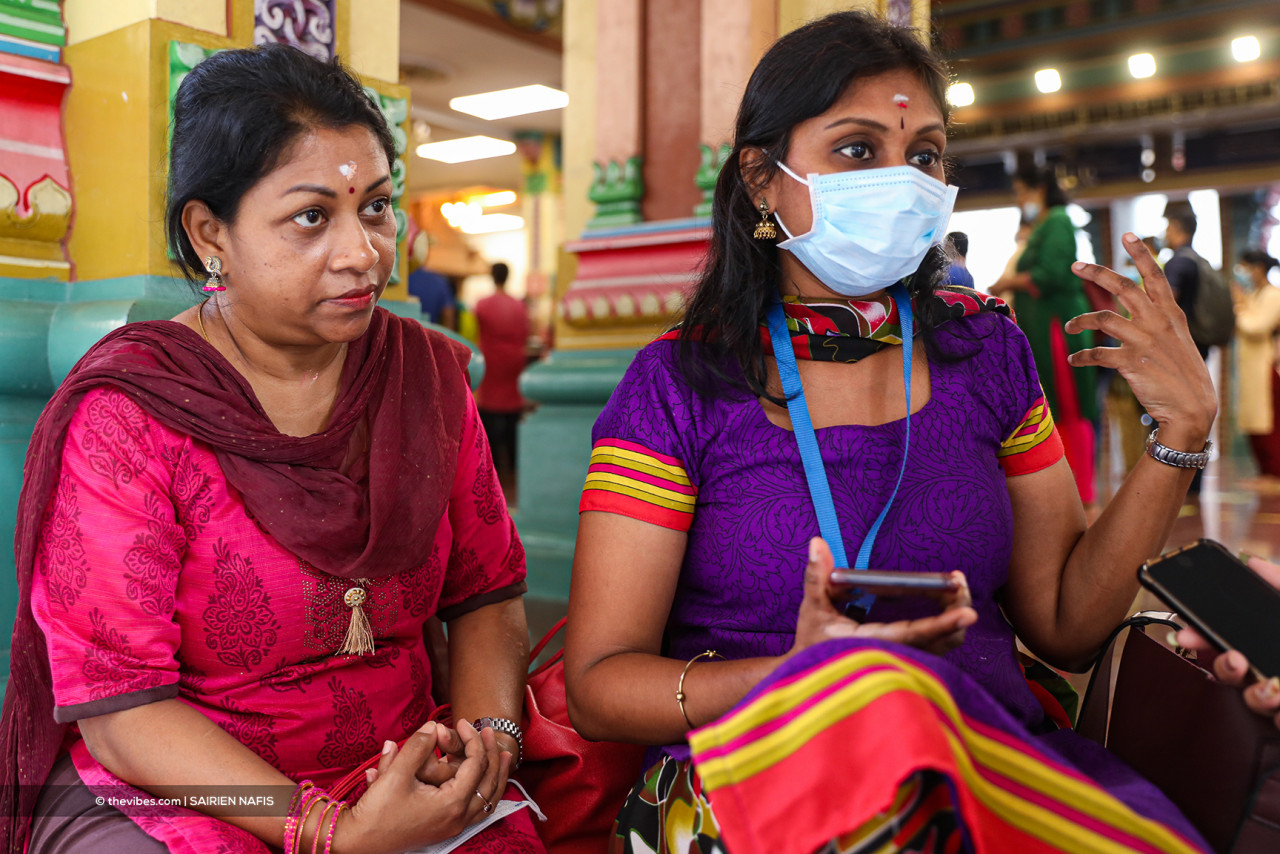 Mariammah Manikam (left) and Purvanam Thirthagiri visiting the Sri Mahamariamman Temple Kuala Lumpur in the morning to observe Varsha Pirappu, aka Tamil New Year, before going off to work. – SAIRIEN NAFIS/The Vibes