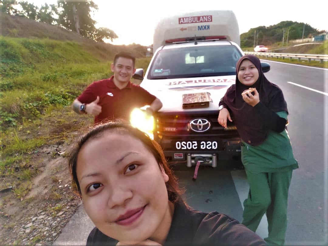 A selfie by staff nurse Sebi (in the foreground) on the Bintulu-Belaga road, when the trio stopped to break fast on the 10th day of Ramadan.  - Pic courtesy of Dr Nur Izatti
