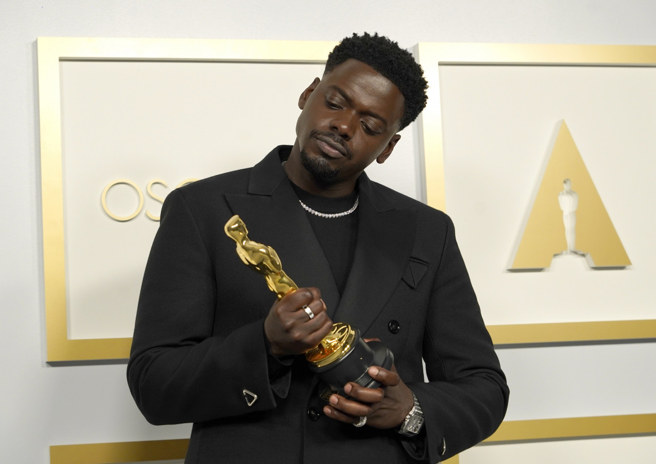 Best supporting actor winner Daniel Kaluuya poses with his award. – EPA pic