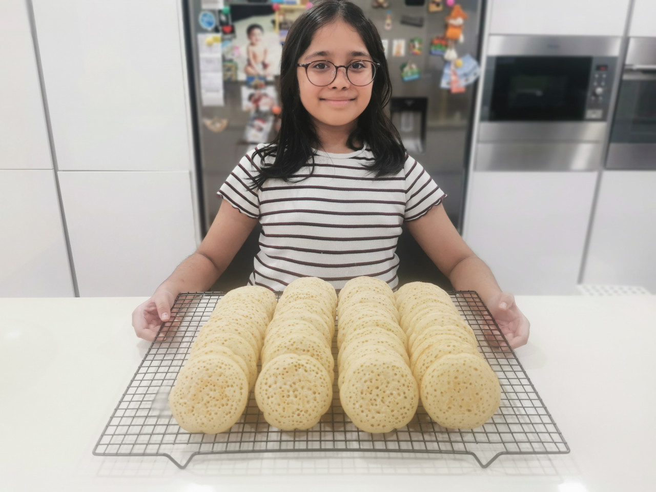 Kaitlyn can make up to 60 crumpets in a day. - Pic by Damien Santer