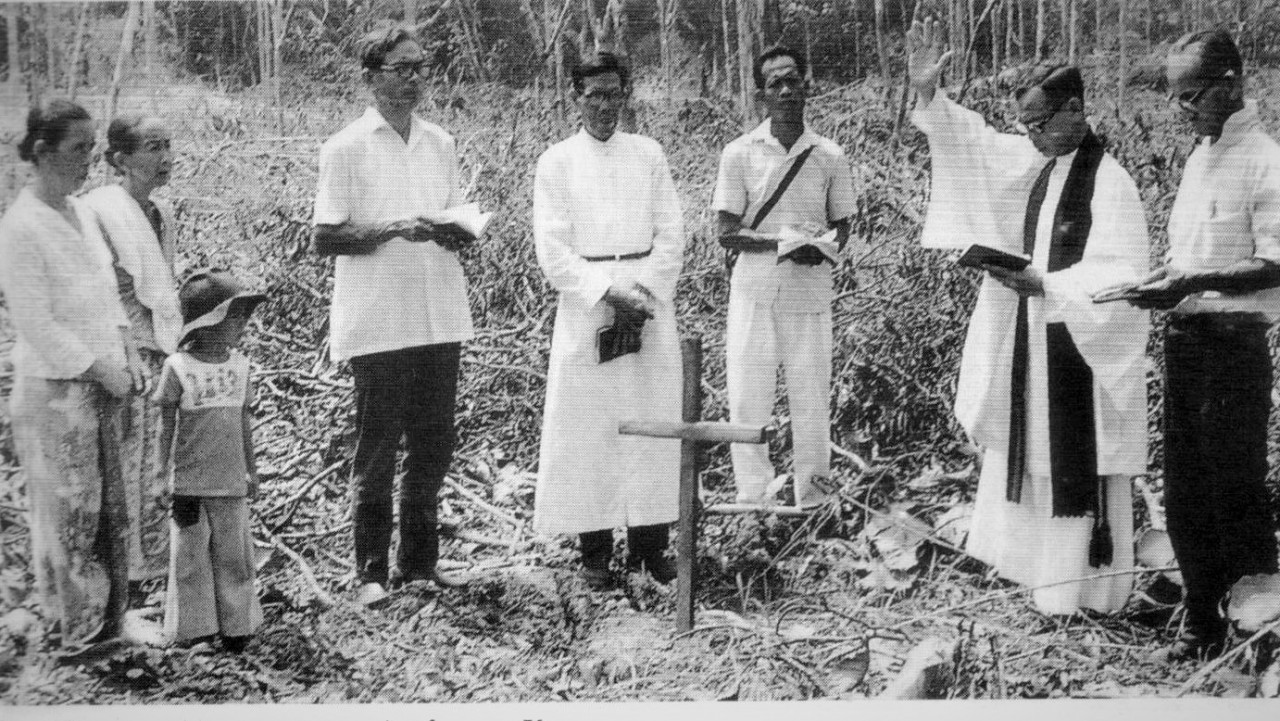 Rev Chambers blessing the beginning of the padi planting season in the village. The advent of Christianity to the village seemed a bit disruptive and came as an intrusion to the guardian spirits of Batu Tipire who expressed their displeasure by causing mischief to the villagers and the Anglican clergy. – Archive pic courtesy of  St James Church