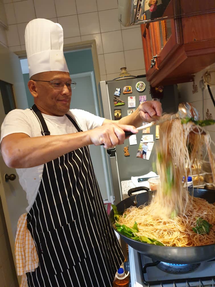 George Juberi cooking in his kitchen for poor families during the first MCO. – Pic courtesy of Margaret Chang