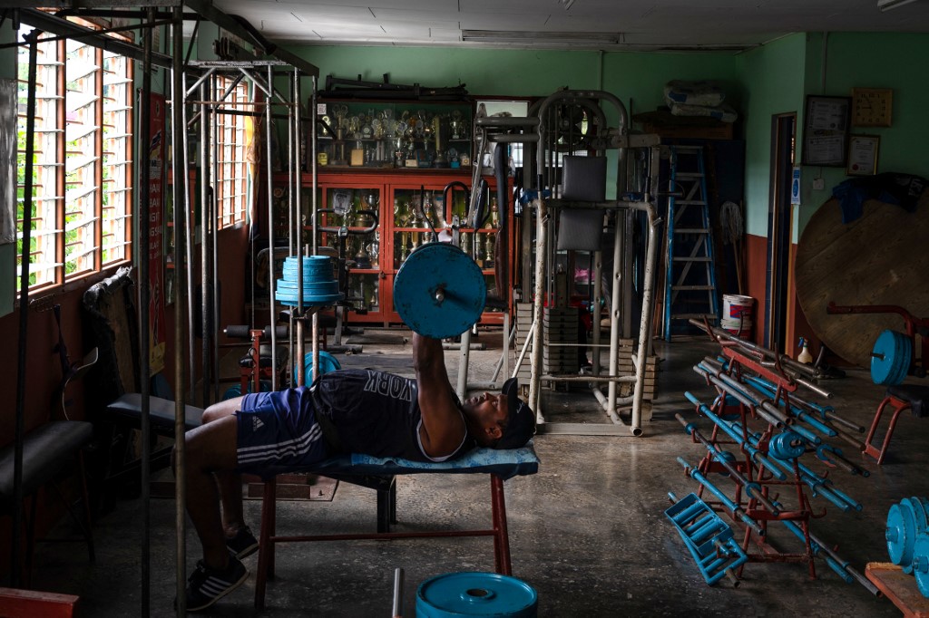 This picture taken on March 18, 2021 shows a man lifting a barbell at A. Arokiasamy's gymnasium in Teluk Intan in Malaysia's Perak state. – AFP pic, March 29, 2021