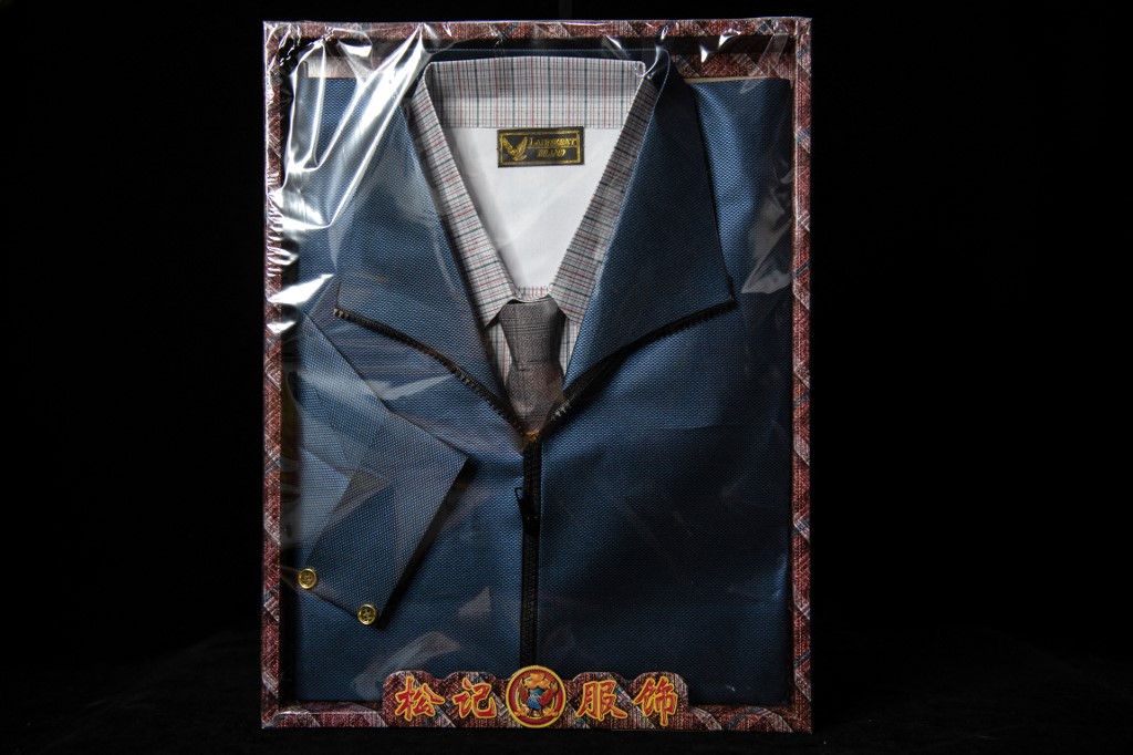 A set of men's clothing made of paper for sale ahead of the Qingming festival. – AFP pic