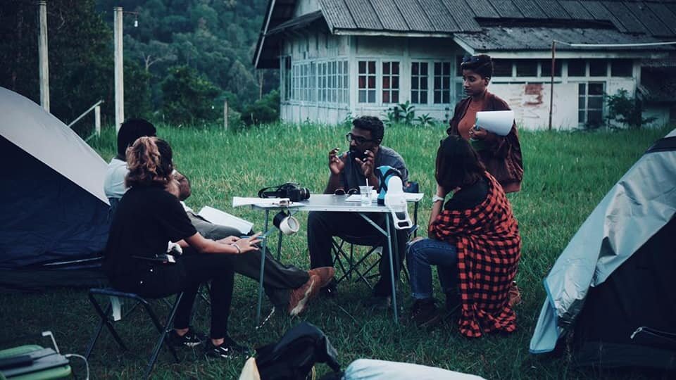 The director speaks to some of the cast. – Pic taken from the Kuman Pictures website