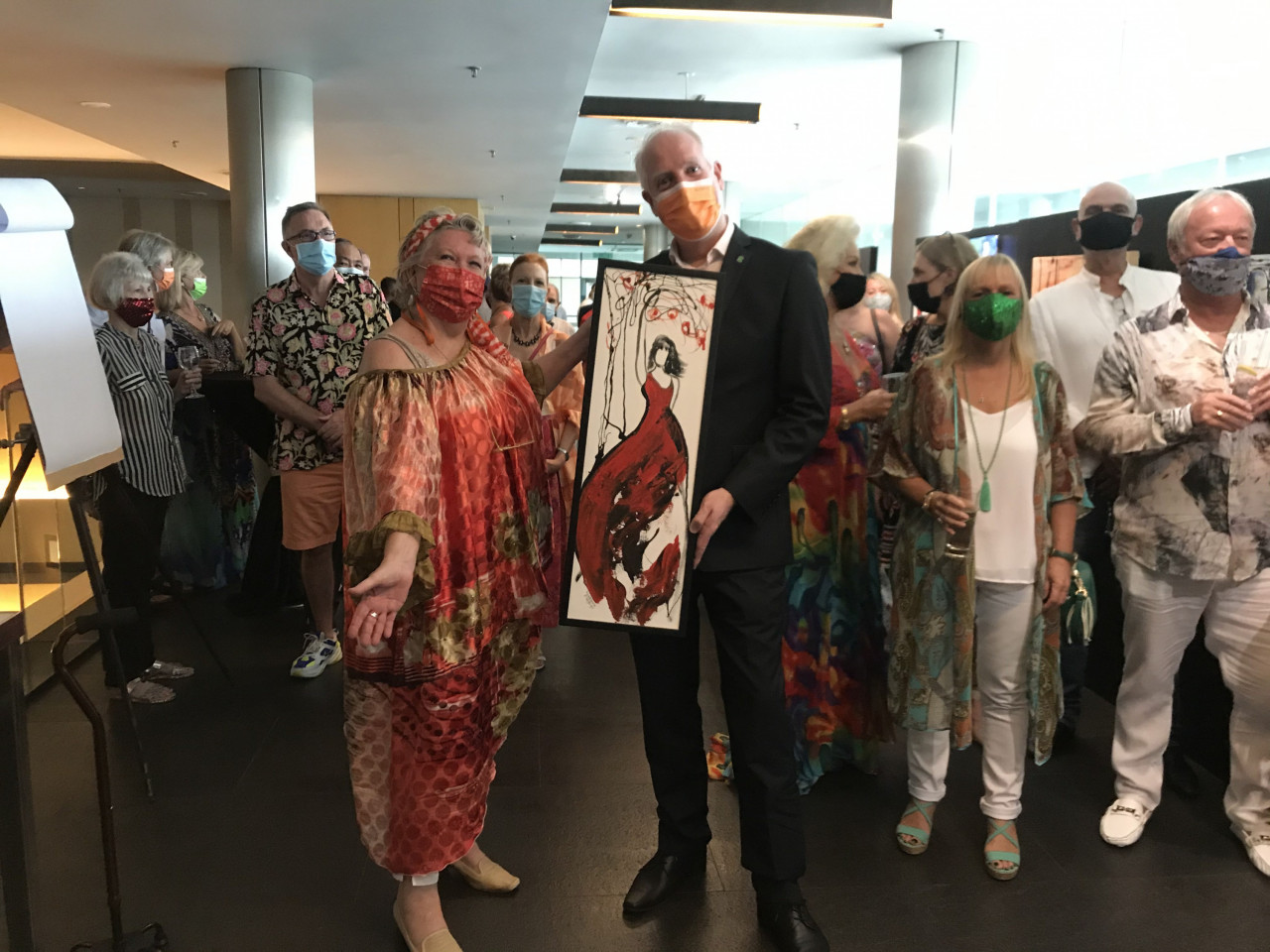 Madeleine and G Hotel GM Michael Hanratty show off the Lady in Red. - Pic by Rachel Yeoh