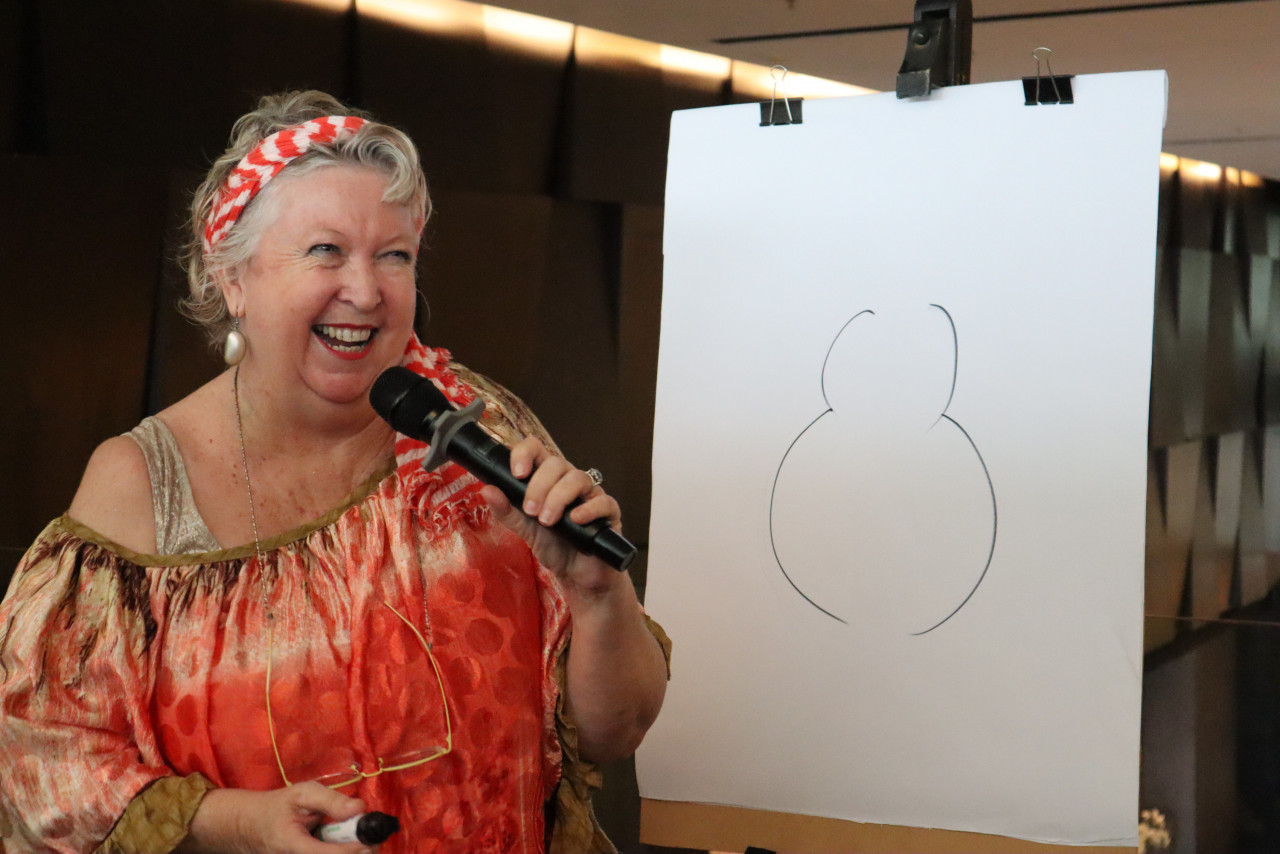 Madeleine giving an art crash course during the launch of her exhibition. - Pic courtesy of G Hotel