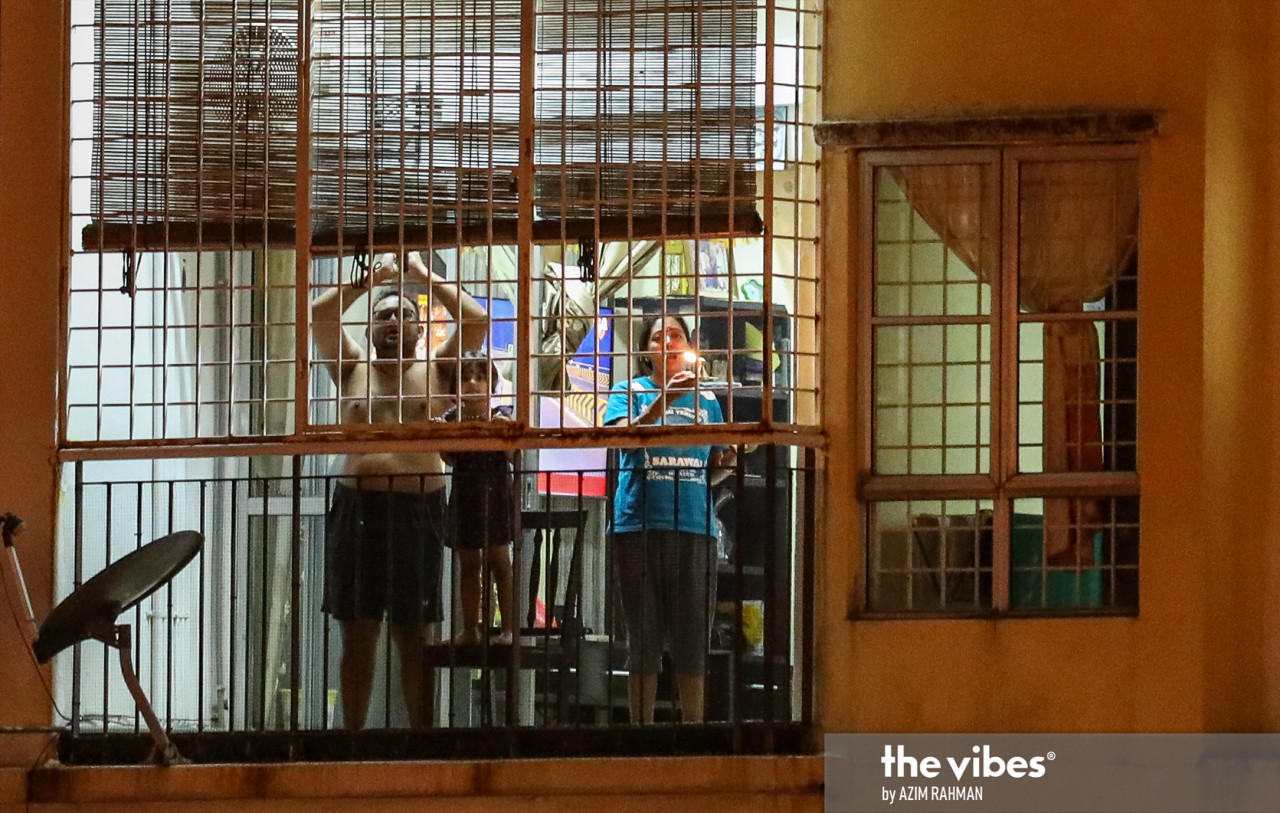 Hindu devotees praying from afar, and safe in their homes. – AZIM RAHMAN/The Vibes, January 28, 2021