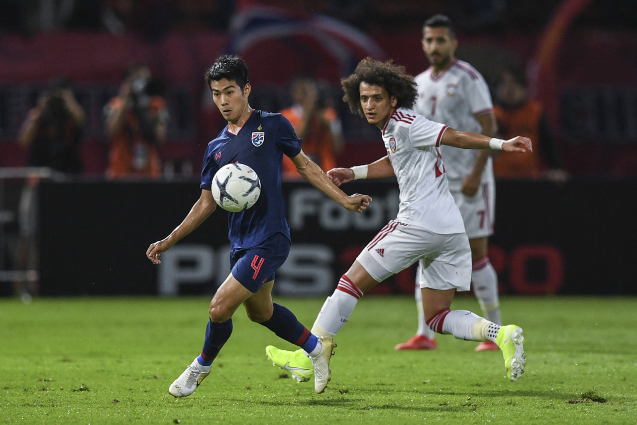 United Arab Emirates' Omar Abdulrahman (right), seen here with Thailand's Sarach Yooyen, during the Qatar 2022 World Cup qualifying football match in 2019