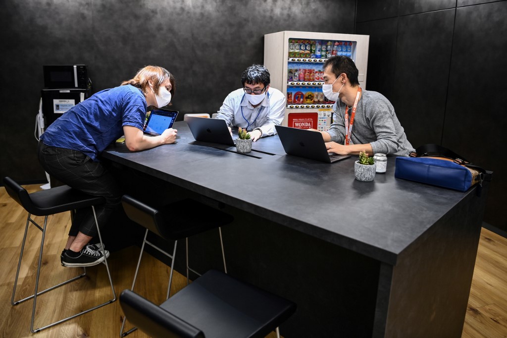 Employees of RevComm, a Tokyo-based AI start-up, working at the company in Tokyo. – AFP pic, October 13, 2020