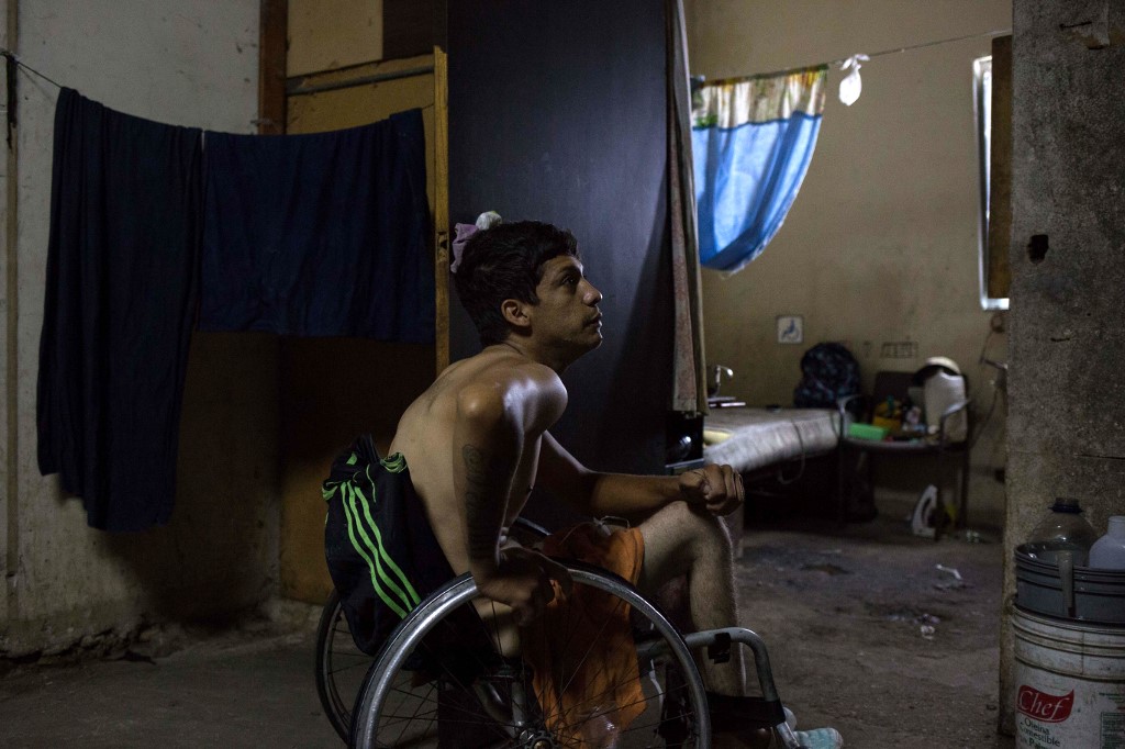 Johan Medina, 31, is seen on his wheelchair by his room at a shelter located in the basement of the Sudameris public building in Caracas, on October 9, 2020. – AFP pic, October 23, 2020