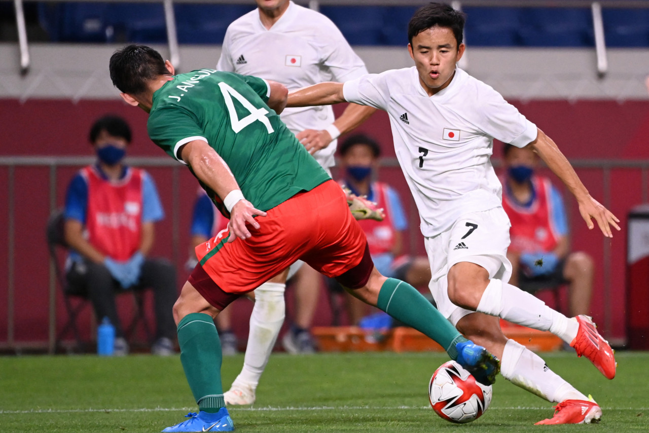 Japan's forward, Takefusa Kubo (right), seen here with Mexico's defender, Jesus Angulo, during the men's bronze medal football match at the recently-concluded Tokyo 2020 Olympic Games