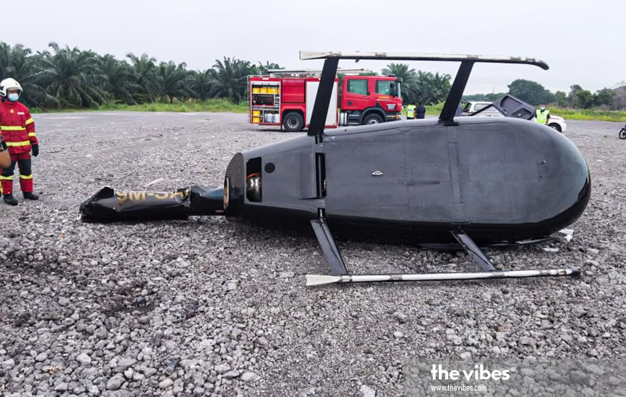 Rescue personnel at the site of the crash of a two-seater Robinson R66 9M-SAW private helicopter in the PKFZ today. – Fire and Rescue Dept pic, January 1, 2021