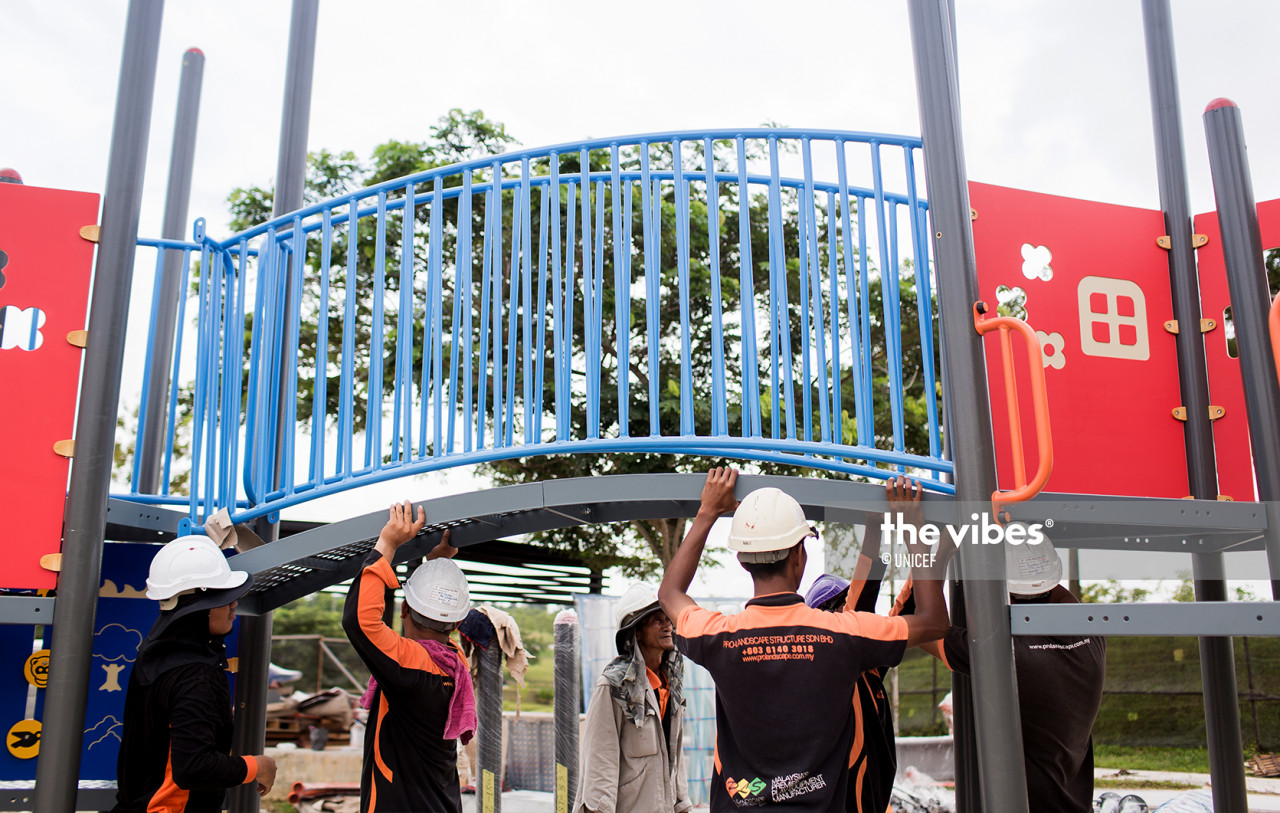 Workers adding finishing touches to Sime Darby Property's Inclusive Playground in the City of Elmina. – Unicef pic, December 3, 2020