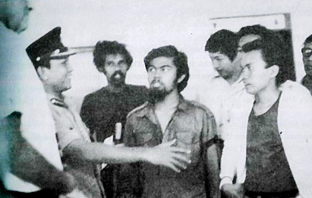 Tok Him (right) and activist Hishamuddin Rais (fourth from right) negotiating with Royal Malaysian Police during the ITM demonstration. – Pic courtesy of 'The Misunderstood Man: An Untold Story' by Ibrahim Ali 