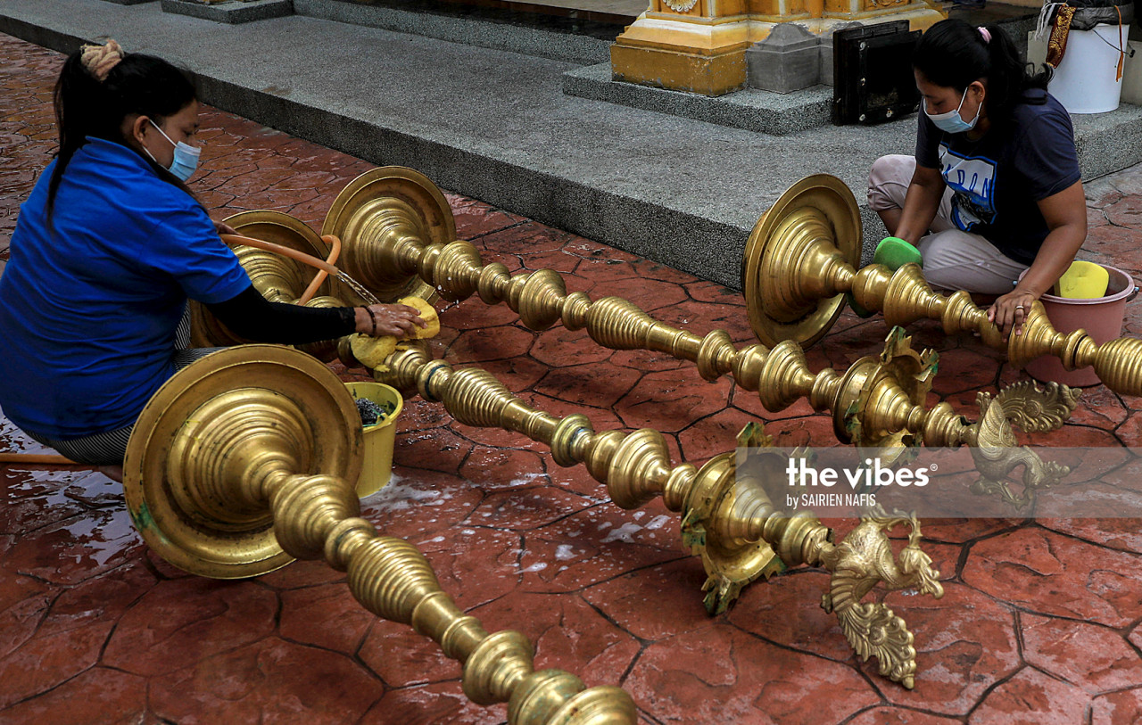 A temple staffer cleaning items ahead of Deepavali. – The Vibes pic, November 14, 2020