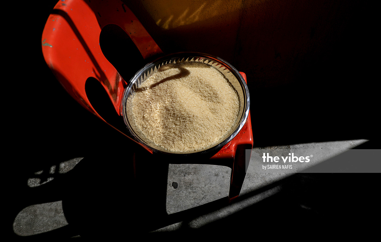 Rice is put on a tray under the sun to dry before it is used to make briyani. – The Vibes pic, November 14, 2020