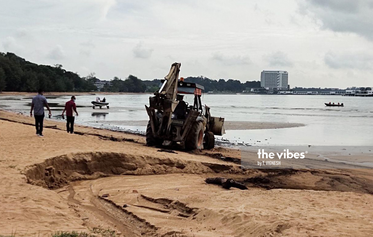 The clean-up work at Pantai Cermin includes removing tainted sand along the beach. – The Vibes pic, October 15, 2020
