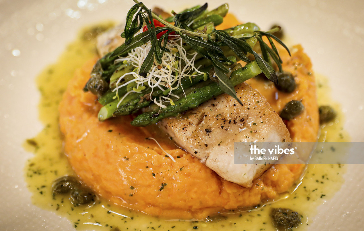 Filetto di Barramundi, or pan seared Barramundi fillet with lemon caper sauce served with green asparagus and sweet mashed potatoes. – The Vibes pic