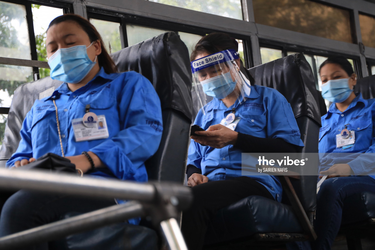 Top Glove workers in the bus