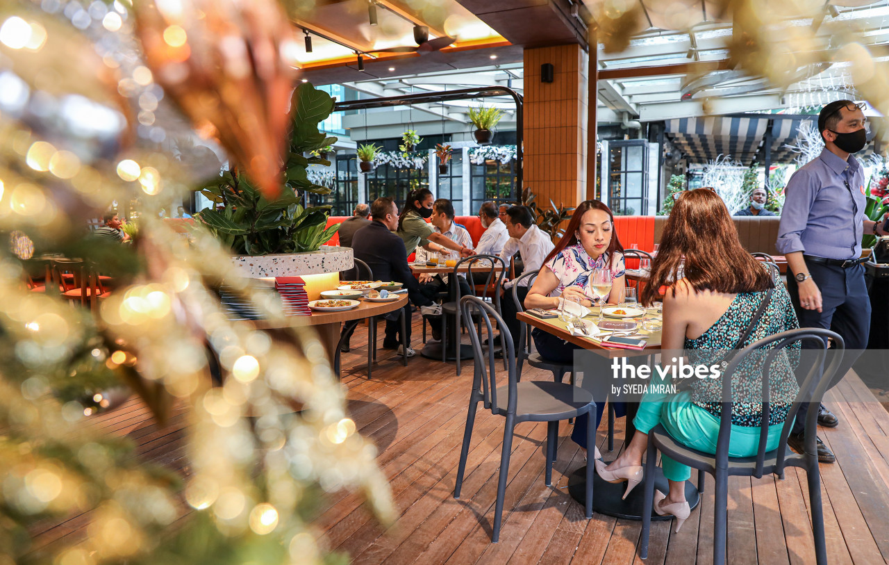 Patrons enjoy the food and ambiance at Roberto's. - The Vibes pic