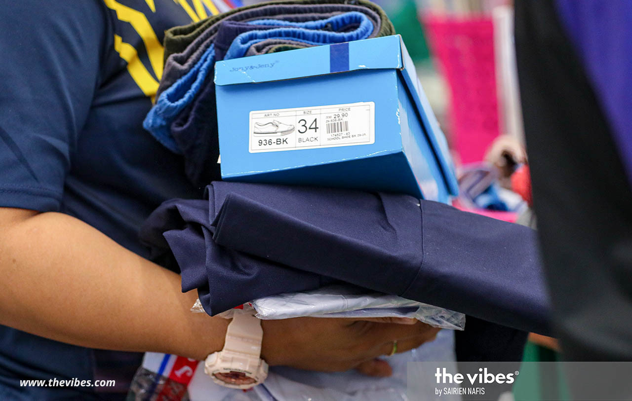 Some students would have outgrown their school supplies bought last year, necessitating a trip to the stores to stock up again. – SAIRIEN NAFIS/The Vibes pic, February 21, 2021