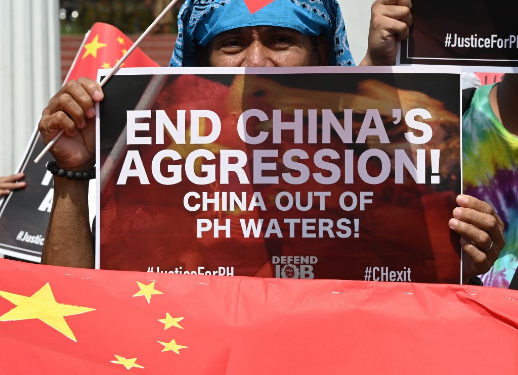 Activists display anti-China placards and flags during a protest at a park in Manila on June 18, 2019, after a Chinese vessel last week collided with a Philippine fishing boat which sank in the disputed South China Sea and sailed away sparking outrage. – AFP pic, September 19, 2020