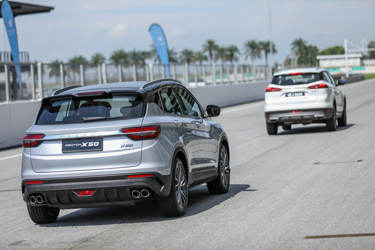 Two Proton X50 Crossovers race along the circuit during last year's media preview event. – Pic courtesy of Proton Cars