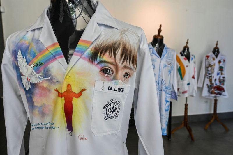 Each of the two dozen coats in the collection bears its doctor's nametag, which forms part of the final work. – AFP pic, October 5, 2020