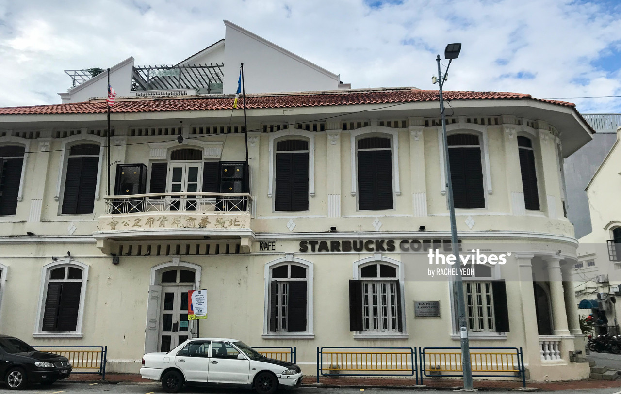 The exterior of the No 1 Jalan Green Hall in Starbucks. The flat roof is not part of the original architecture. The original two angled roofs (as seen on the next building) were bombed off during World War 2. – RACHEL YEOH/ The Vibes pic