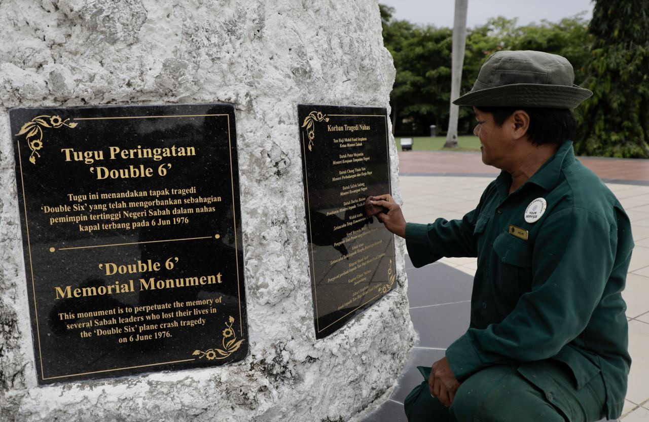 State landscape department gardener, Azlan Karim, sprucing up the nameplate of victims of the tragedy. – The Vibes pic, September 21, 2020