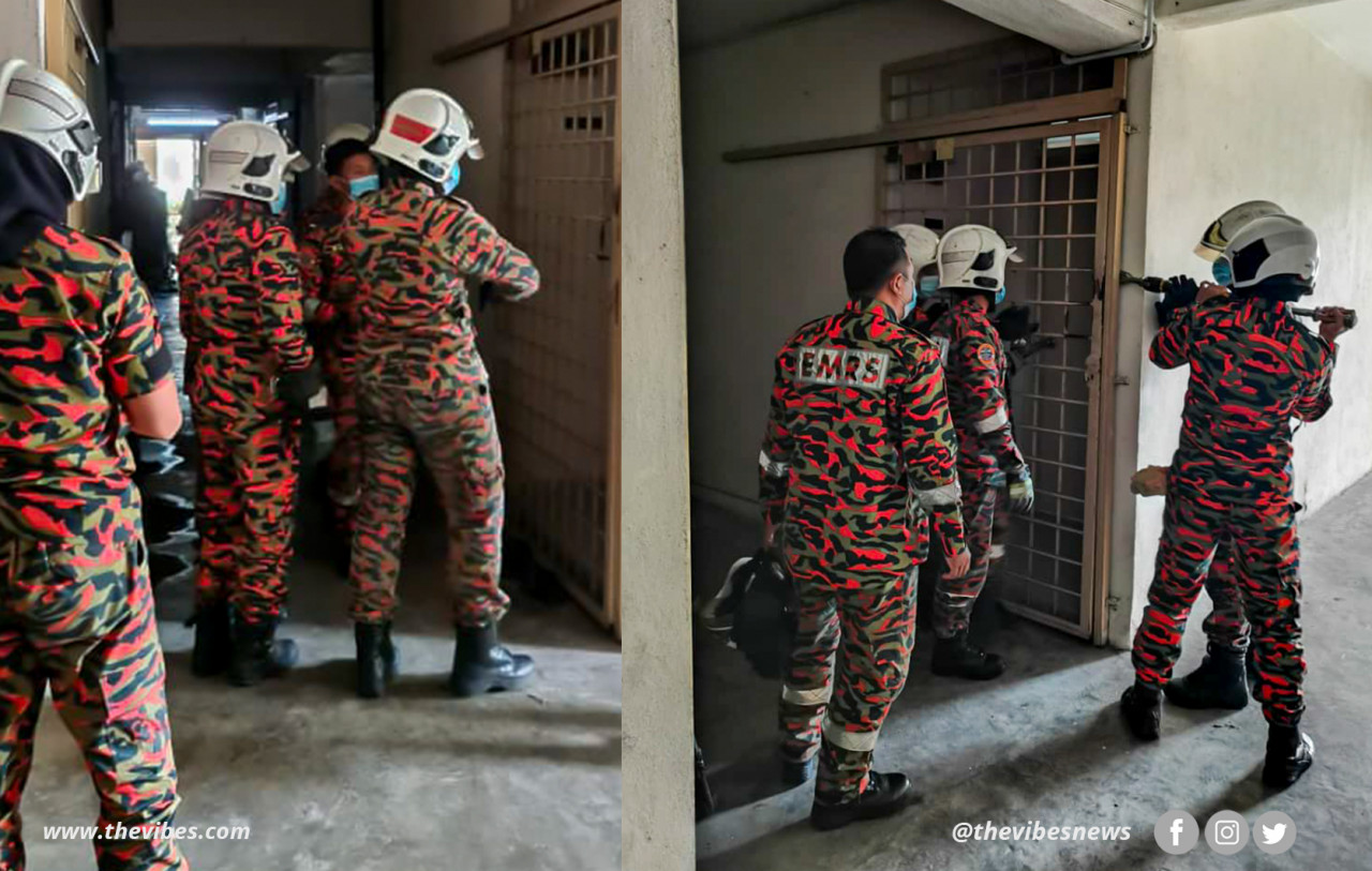 Fire and Rescue Department personnel prying open the front door of an apartment unit of a building on Thean Teik Highway, Air Itam, Penang. – File pic, January 29, 2021