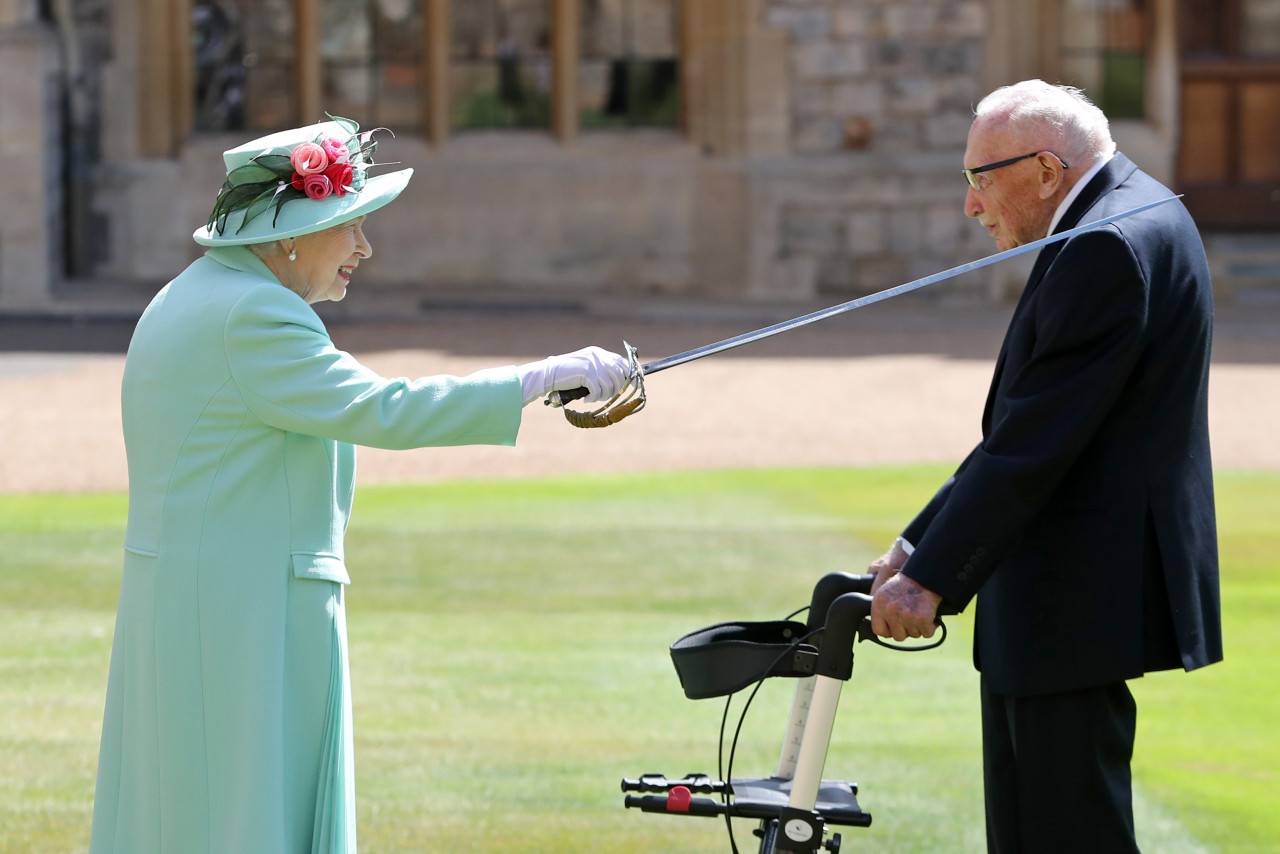 Queen Elizabeth II awarding Captain Sir Tom Moore a knighthood last year. – AFP pic, February 3, 2021