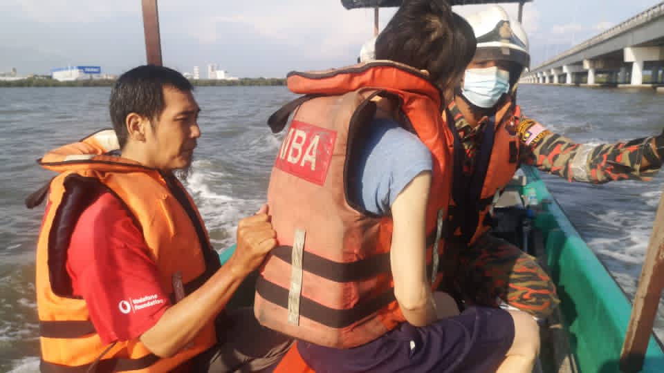 The couple after being rescued from the Penang Strait. Their son was left on the bridge alone while they were in the water. – Penang Fire and Rescue Department pic, April 16, 2021