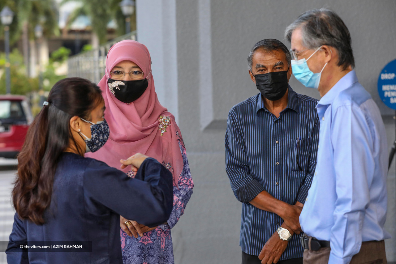 The parents of Syed Saddiq Syed Abdul Rahman outside the KL Sessions Court today. – AZIM RAHMAN/The Vibes pic pic, July 21, 2021