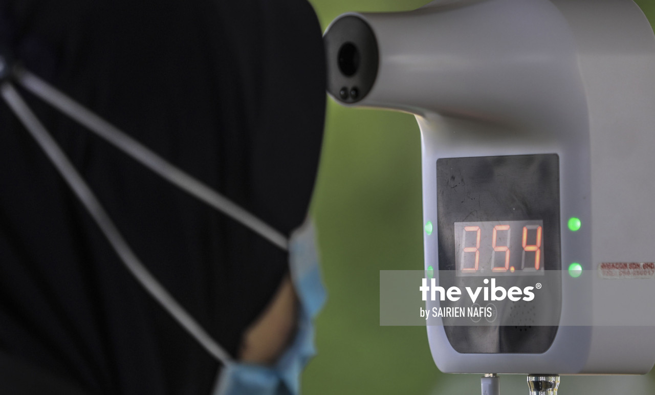 Checking body temperature is one of the new norms after during the Covid-19 outbreak. – The Vibes pic, September 22, 2020