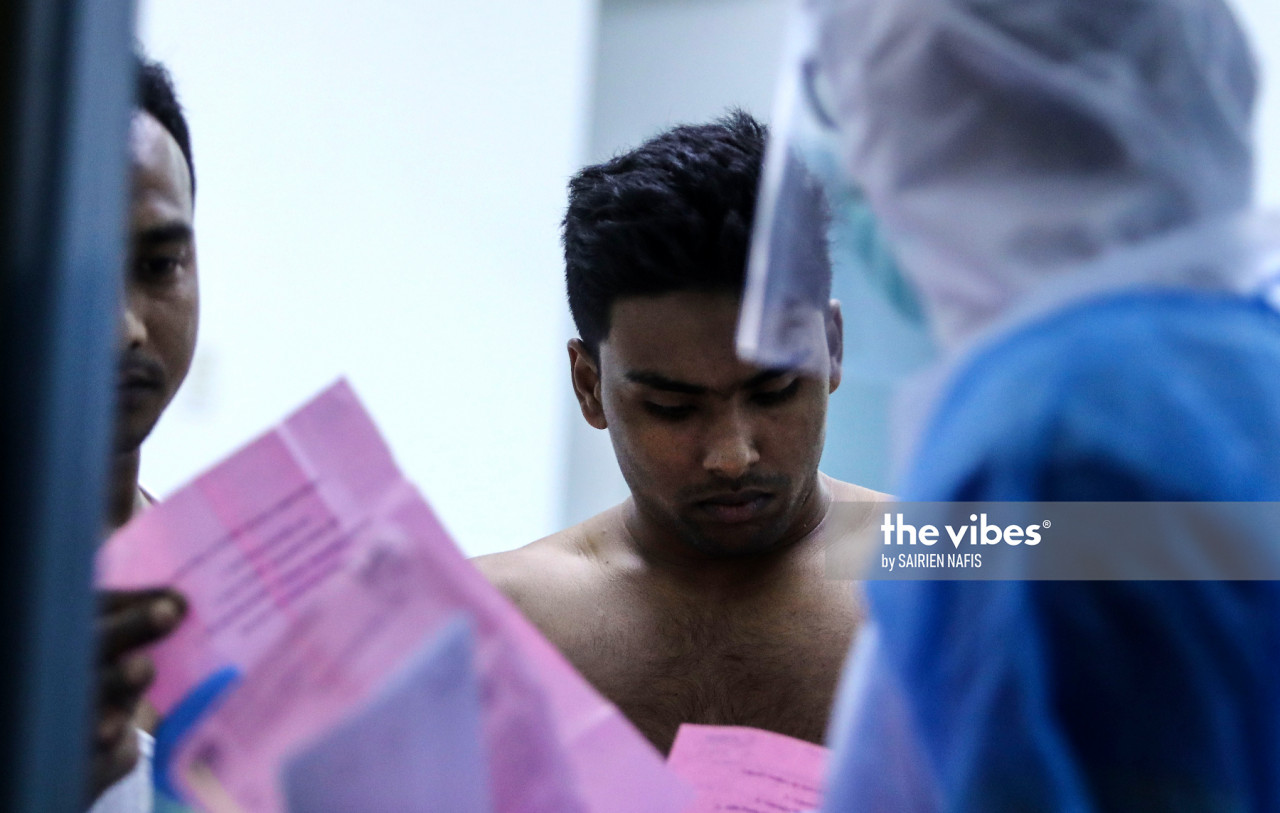 Petaling health officers at the Pelangi apartment in Damansara conducting swab test - The Vibes