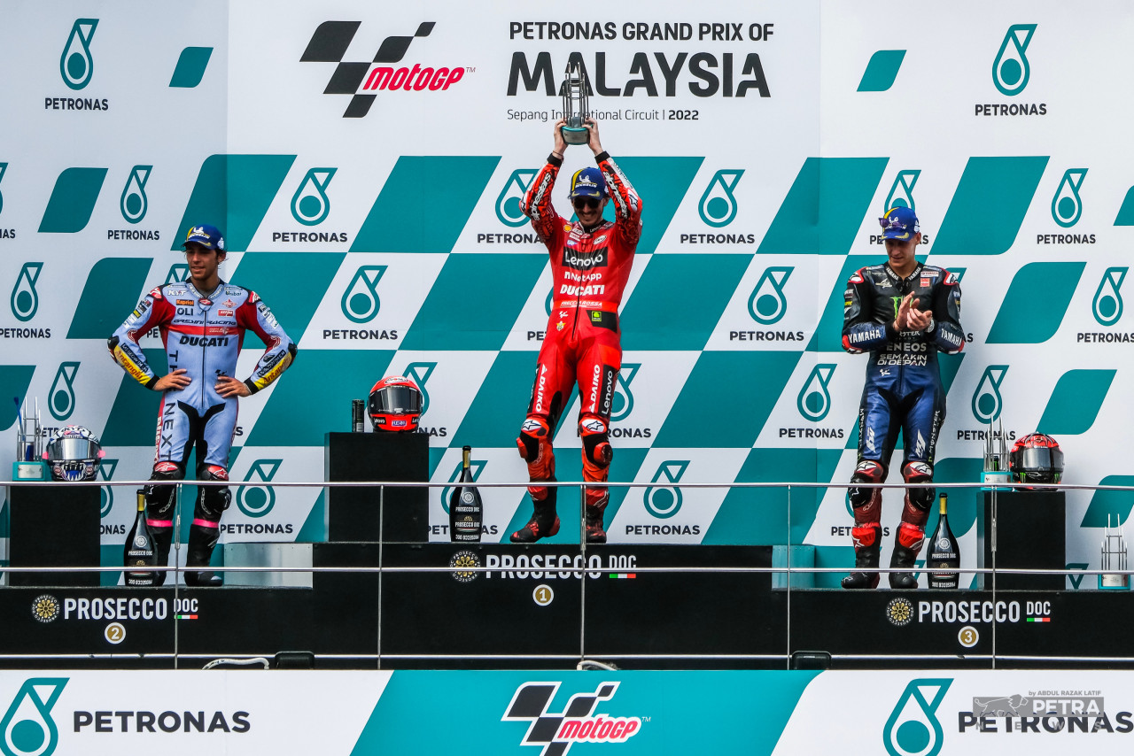 Francesco Bagnaia (centre), Enea Bastianini (left), and Fabio Quartararo (right) on the podium after the chequered flag dropped for the Malaysian MotoGP. – ABD RAZAK LATIF/The Vibes pic, November 3, 2022