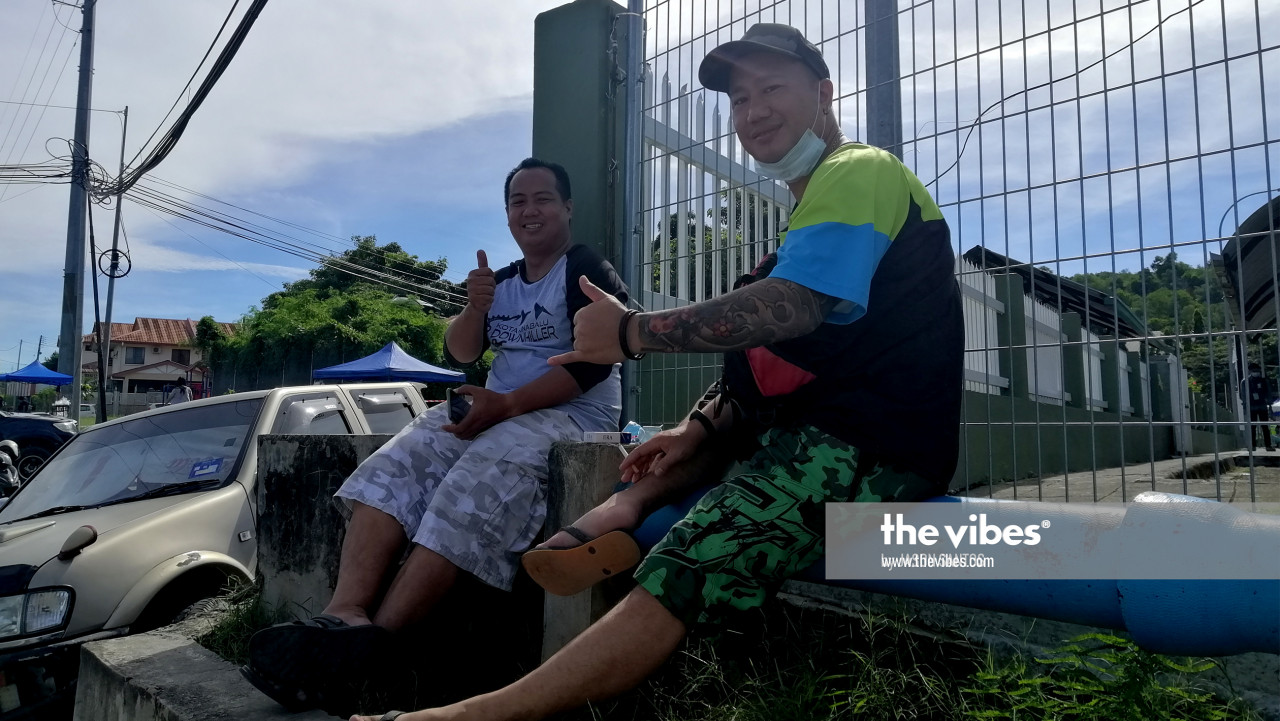Two voters outside SK Kolombong, Inanam. – The Vibes pic, September 26, 2020