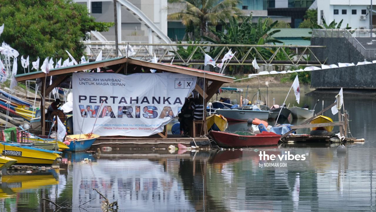 Fishing boats anchored in Kg Sembulan carry a big banner saying ‘Pertahankan Warisan’ (Defend Warisan). – The Vibes pic, September 26, 2020