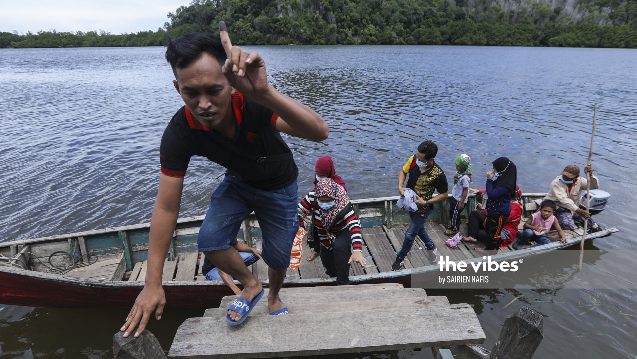 Voters came back after casting their vote using boat at Jetty Kampung Penimbawan, Tuaran. - SAIRIEN NAFIS/ The Vibes, September 26, 2020.