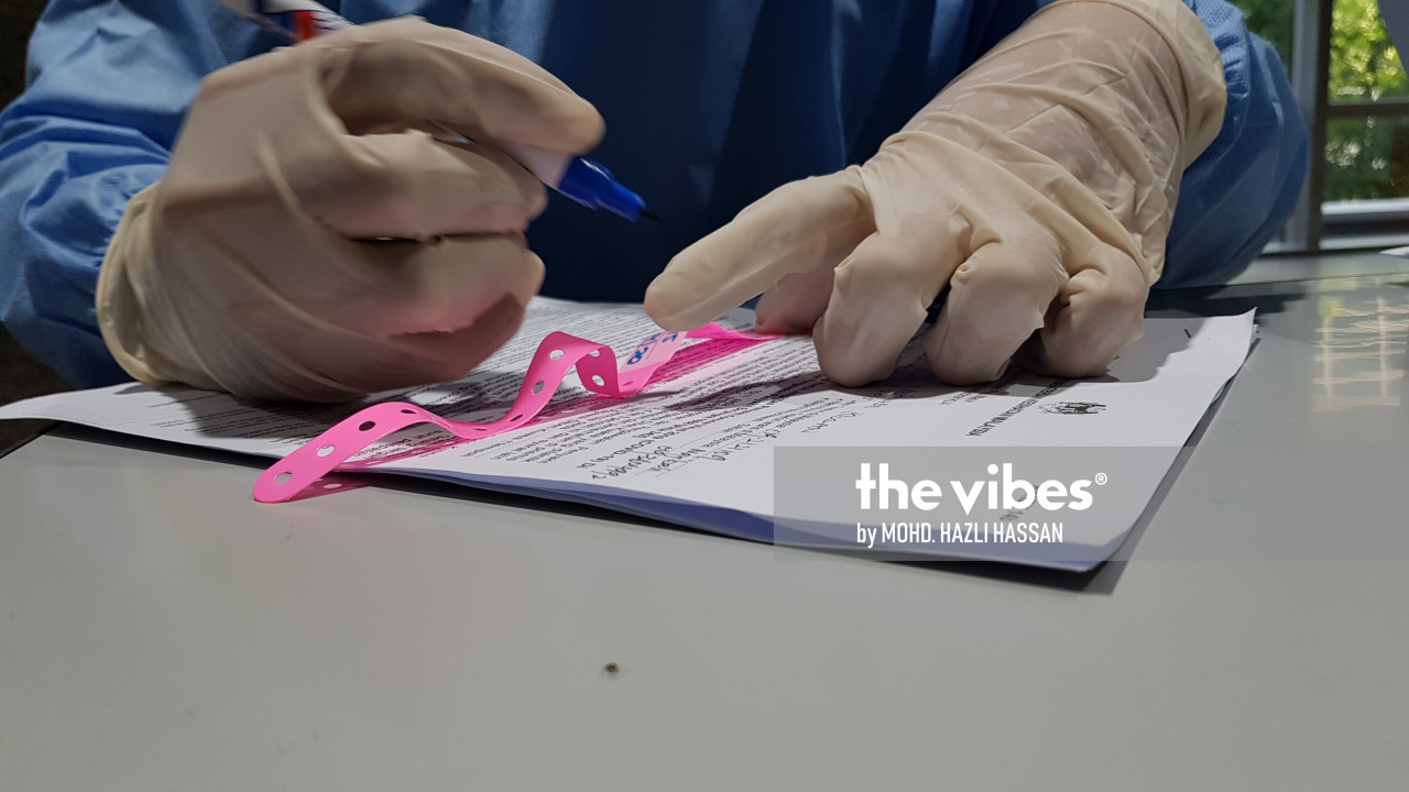 The pink wristband issued to persons under surveillance. – The Vibes file pic, December 2, 2020