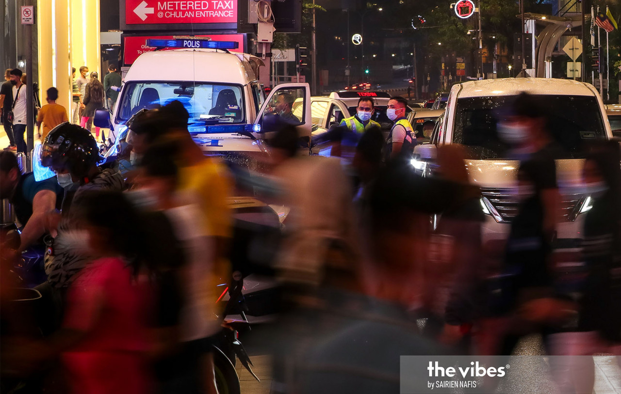 Enforcement officers overseeing pedestrians in Bukit Bintang. – The Vibes pic, January 1, 2021