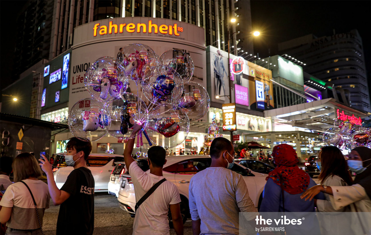 While many were wearing masks, there was little social distancing on display in Bukit Bintang yesterday. – The Vibes pic, January 1, 2021