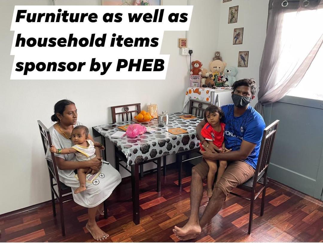S. Ganesh and his wife, Parameswary, and their children at their PPR home with furniture and household items sponsored by PHEB. – File pic, January 14, 2021
