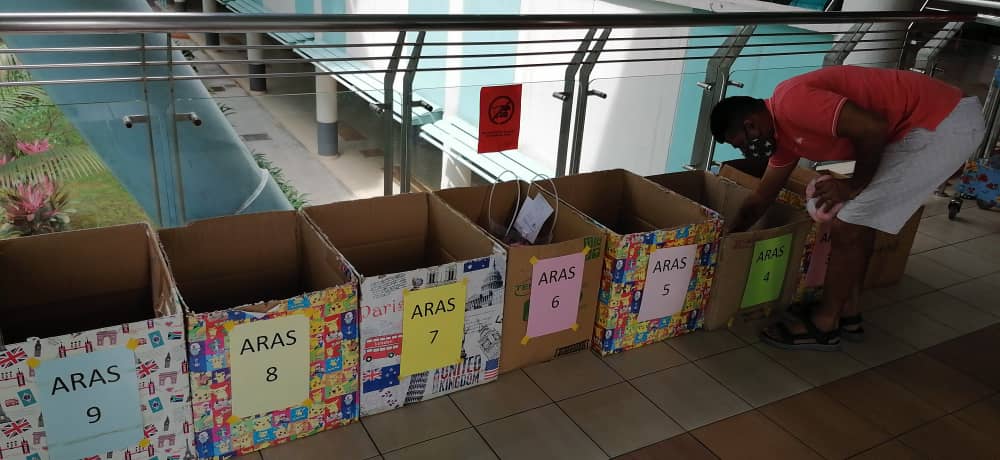 Upon arrival at Sungai Buloh Hospital, the packets are carefully allocated for delivery to the wards. – Pic courtesy of Jasvinder Singh