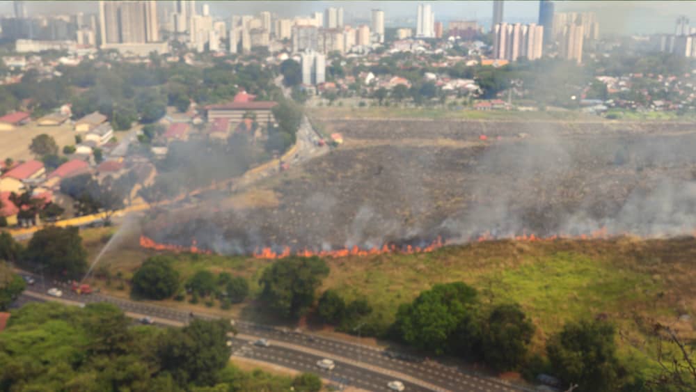 The blaze razing the Batu Lanchang cemetery is expected to take another six hours to control. – Penang Fire and Rescue Department pic, February 6, 2021